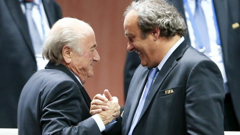 File picture shows UEFA President Platini congratulating FIFA President Blatter after Blatter was re-elected at the 65th FIFA Congress in Zurich